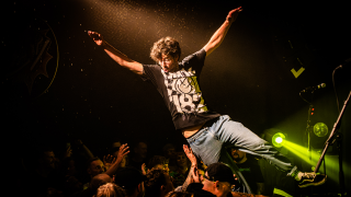 man crowdsurfing at no barrier